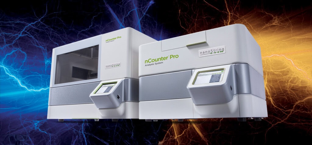 An nCounter Pro instrument on a blue and orange lightening background.